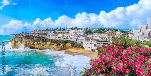 Carvoeiro town with colorful houses and yellow sand beach in Algarve, Portugal photo