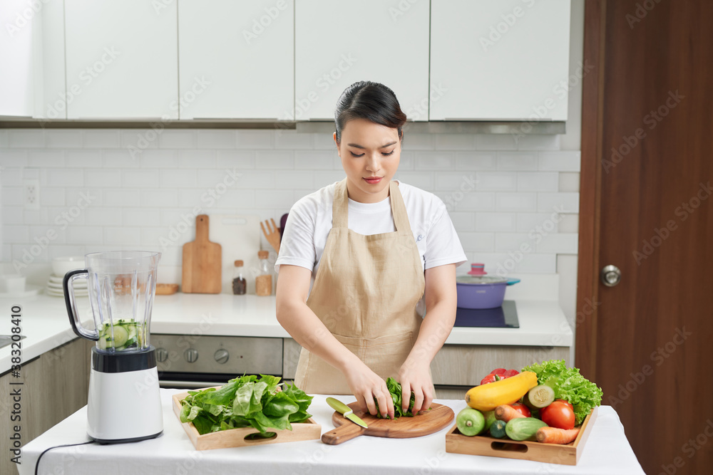 Healthy eating lifestyle concept portrait of beautiful young woman preparing drink with vegetables and greens. Healthy eating lifestyle concept portrait of beautiful young woman preparing drink with vegetables and greens.
