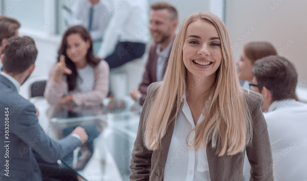 close up. smiling young employee standing in the office close up. smiling young employee standing in the office