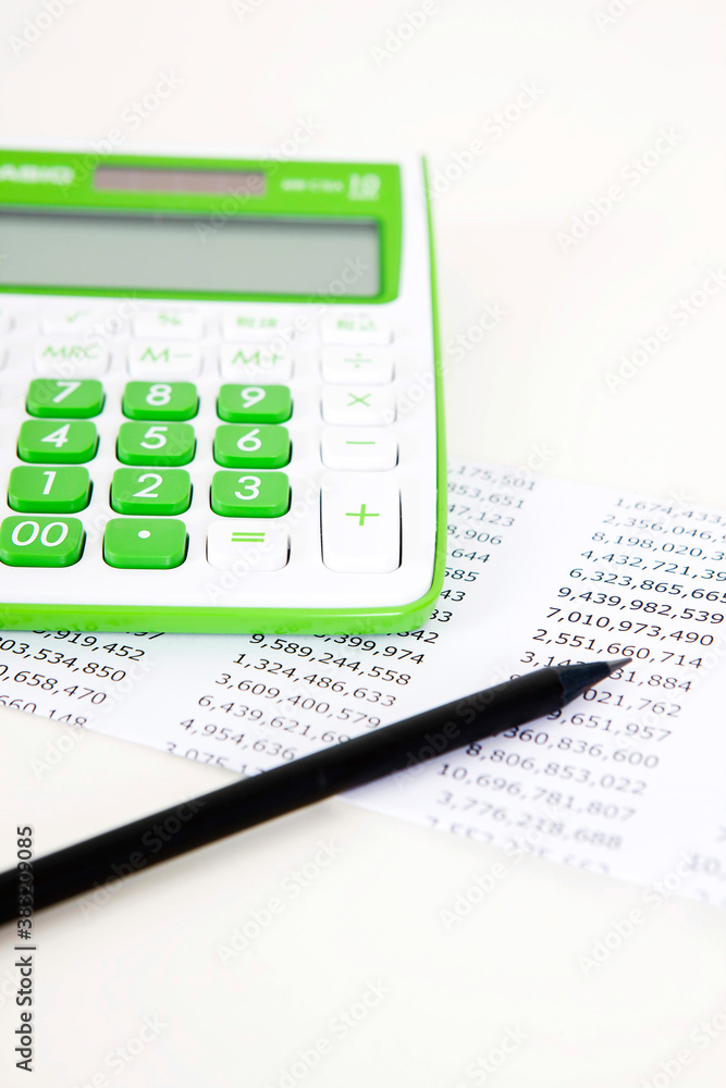 calculator and pencil on paper calculator and pencil on paper