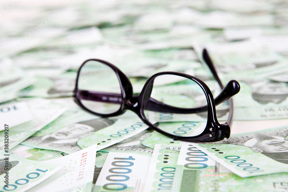 South Korean Won currency and glasses South Korean Won currency and glasses