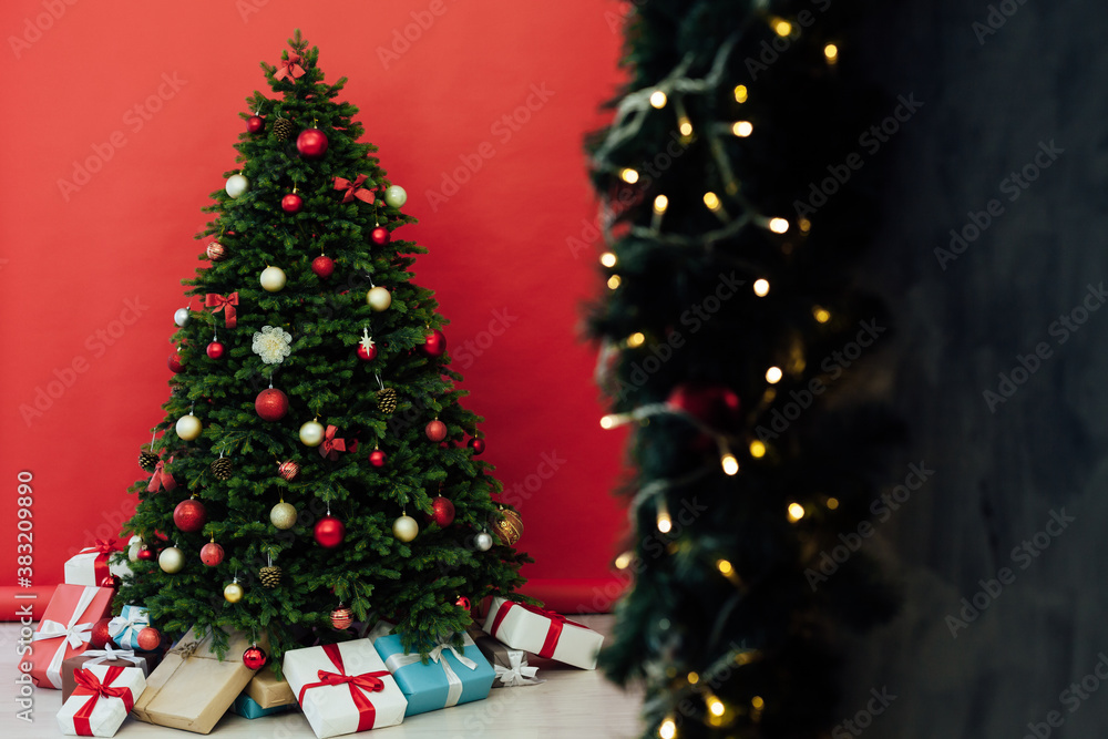Christmas tree pine with gifts new year decor garland interior of the holiday house December