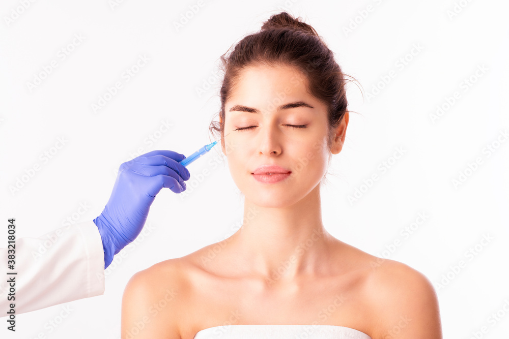 Beautiful woman getting cosmetic procedures for the face