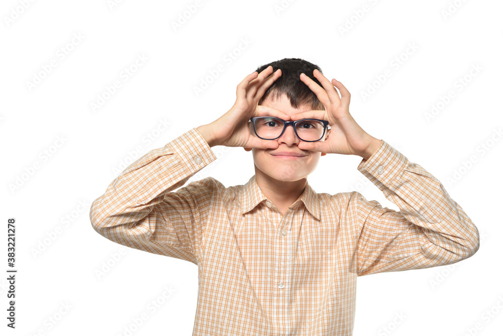 Cheerful teen boy holding his glasses on his face Cheerful teen boy holding his glasses on his face