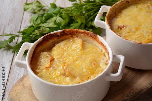 Potato gratin in baking white cocotte