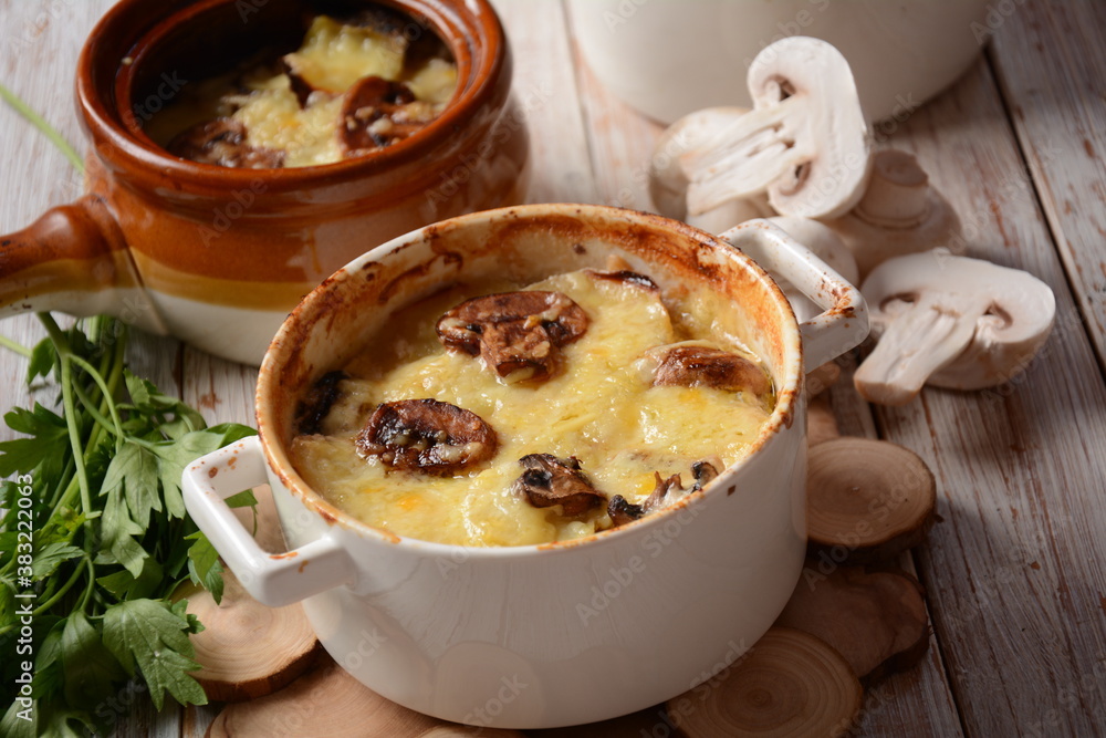 Potato gratin with mushrooms in baking cocottes Potato gratin with mushrooms in baking cocottes