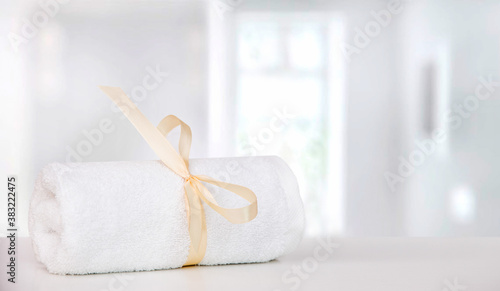 Fototapeta Naklejka Na Ścianę i Meble -  White moss towel on white table