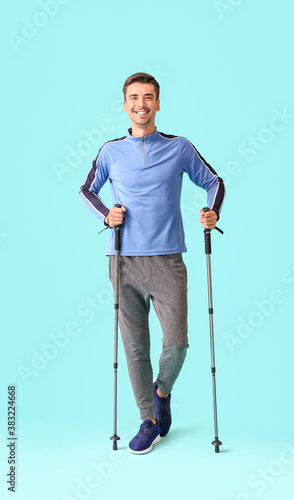 Young man with walking pole...