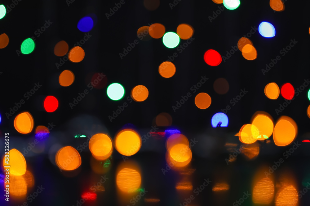 Obraz premium Blurred Christmas lights on dark background