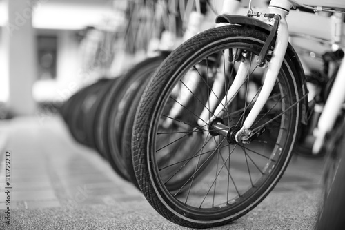 Close up the vintage bicycles in the shop as black and white photo.