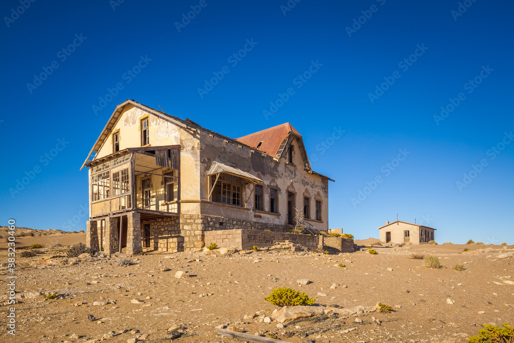 Abandoned colonial house in Kolmanskop ghost-town in the Namib desert in namibia