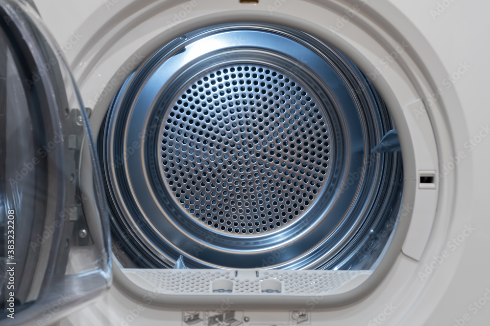 View inside of a clothes dryer, close up. Empty tumble dryer. View inside of a clothes dryer, close up. Empty tumble dryer.