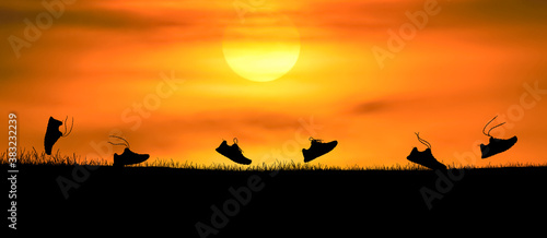 Concept design for Trail running   Silluette running Shoe runnong along the track at the sunset time.