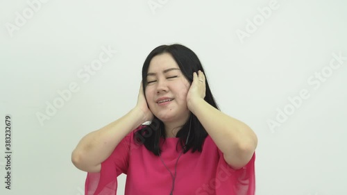 Happy joyful fun smiling woman music lover with  headphones listening favorite song, dancing and enjoying music 