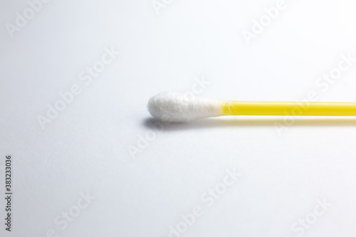 Ear cotton swab on the white background.