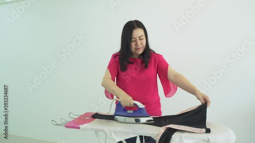 joyful  young woman in  ironed  house
