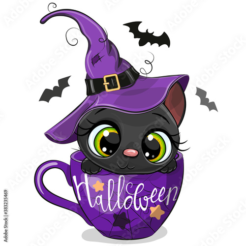 Kitten in a witch hat is sitting in a Cup of coffee
