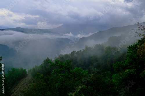 fog over the mountains landscape. Cloudy sky. Natural background. Copy space 