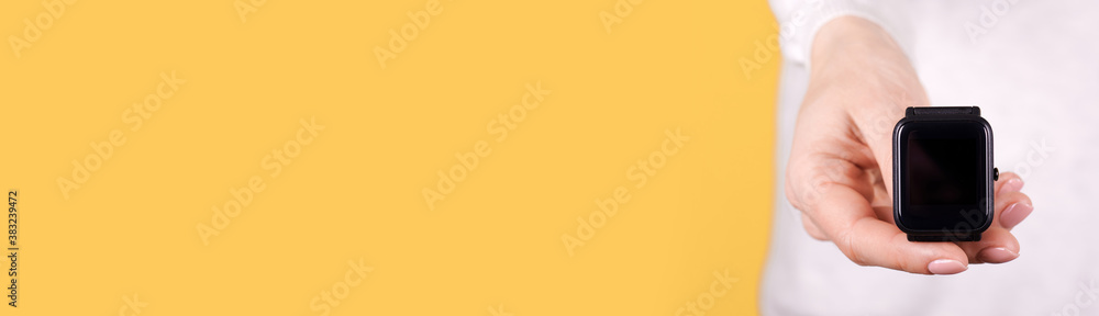 Black smart watch in hand, copy space template, banner.