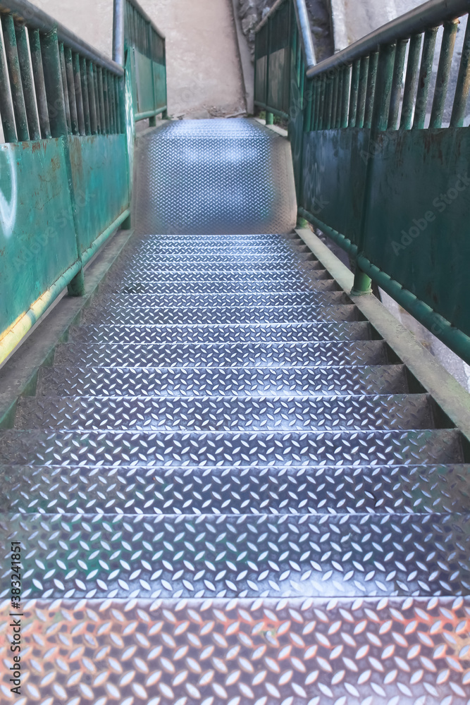 Obraz premium Old steel stairs of overpass on background , high walkway down