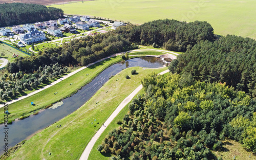 Fototapeta Naklejka Na Ścianę i Meble -  Top view of a beautiful city summer park with a river