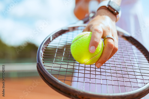 Close up of a tennis player standing ready for a serve © CreaFoto