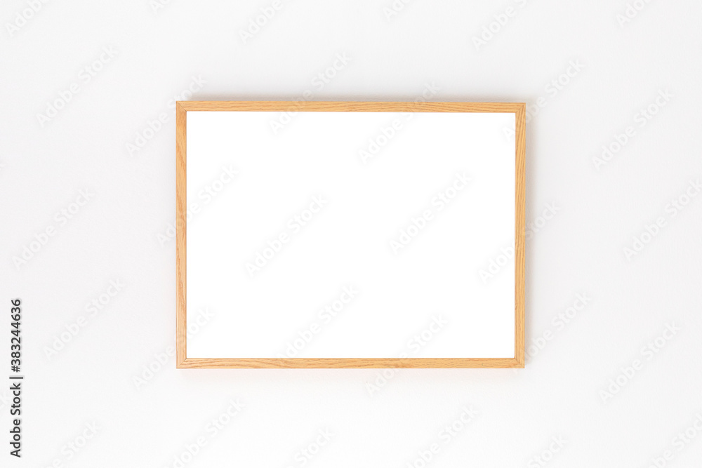 wooden picture frame on a white wall, mockup wooden picture frame on a white wall, mockup