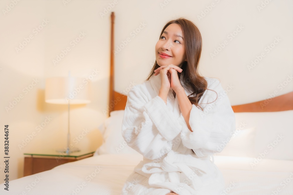 Portrait beautiful young asian woman smile relax on bed in bedroom interior Portrait beautiful young asian woman smile relax on bed in bedroom interior