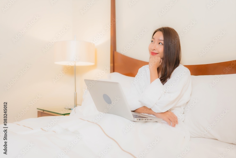 Portrait beautiful young asian woman use laptop on bed Portrait beautiful young asian woman use laptop on bed