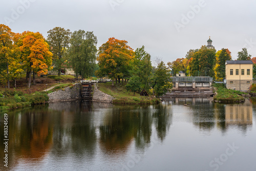Autumn view of the Stromsholms canal in Sweden with colorful autumn trees and calm water