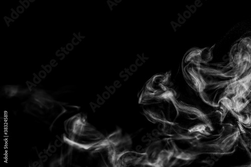 White natural steam smoke effect on solid black background with abstract blur motion wave swirl use for overlay in vapor cigarette, hot boil food and water