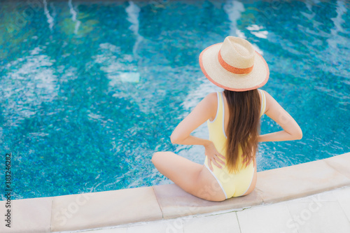 Portrait beautiful young asian woman relax smile leisure around outdoor swimming pool