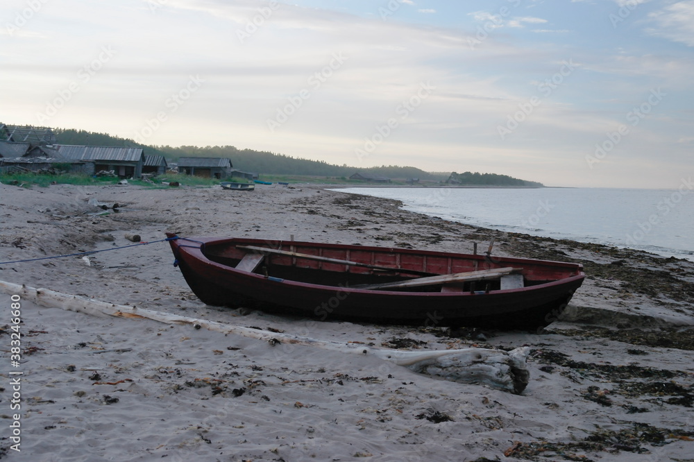 wooden fishing boat on the White sea coast of a fishing village
wooden fishing boat on the White sea coast of a fishing village