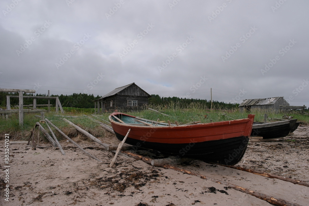 wooden fishing boat on the White sea coast of a fishing village
wooden fishing boat on the White sea coast of a fishing village