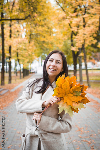 Beautiful girl portrait in autumn park