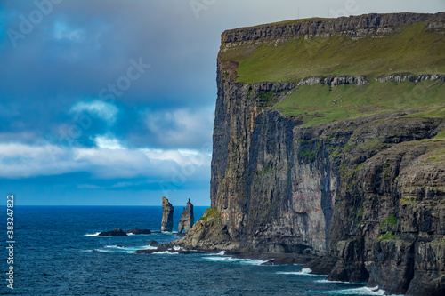 Risin og Kellingin of faroe islands in the horizon photo