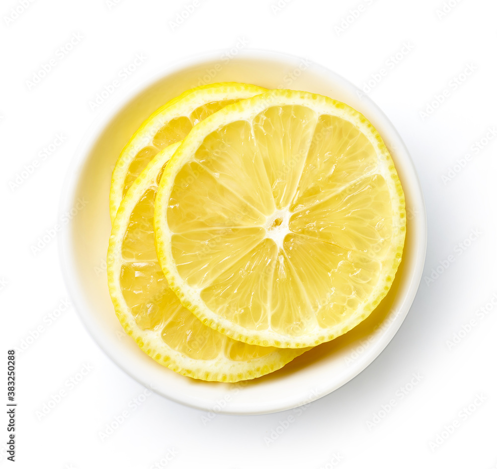 Bowl of lemon slices isolated on white, from above Bowl of lemon slices isolated on white, from above