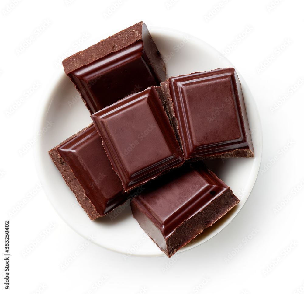 Bowl of dark chocolate isolated on white, from above Bowl of dark chocolate isolated on white, from above