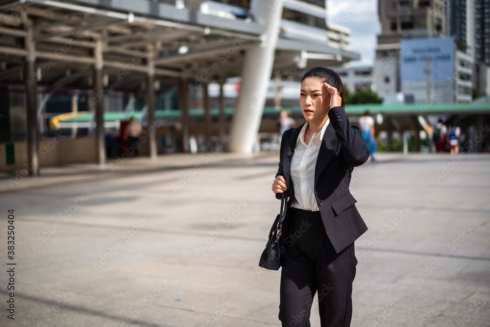 woman walking ang headache about business problem in city woman walking ang headache about business problem in city