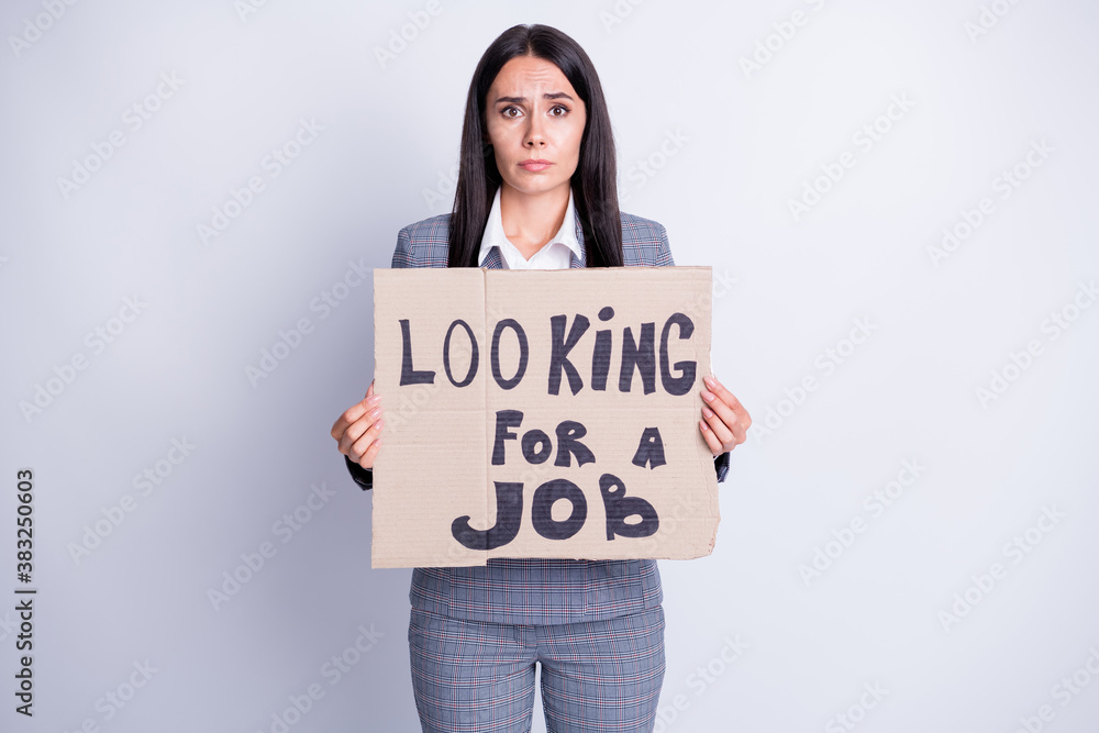 Photo of attractive fired sad terrified lady hold carton placard seek job agree accept any offer work proposition need money for living formalwear plaid suit isolated grey color background Photo of attractive fired sad terrified lady hold carton placard seek job agree accept any offer work proposition need money for living formalwear plaid suit isolated grey color background