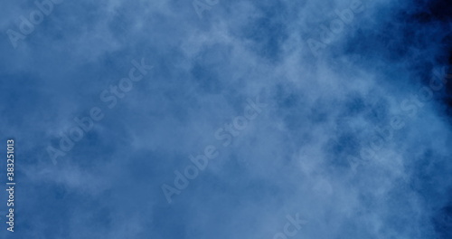 Abstract 4k resolution defocused cloud background for backdrop, wallpaper and varied design. Dark blue, blue gray and electric blue colors.