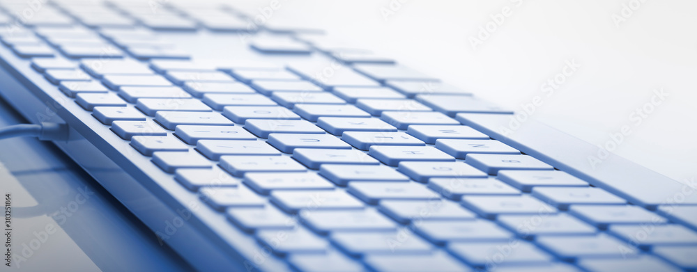 Blue color keyboard close-up view. Soft focus in the center of image. Useful horizontal banner.