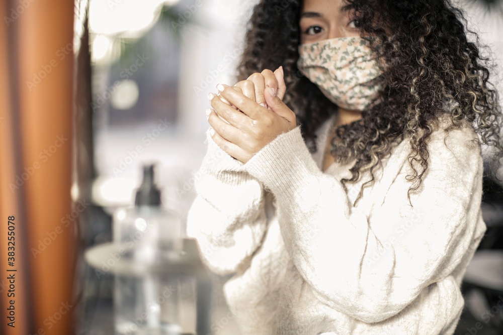 Young woman with virus-mask is take her hands wet Young woman with virus-mask is take her hands wet