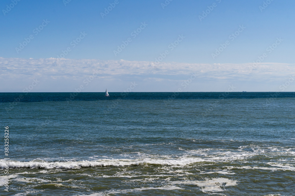 A yacht in the sea. Autumn daylight at the Black sea. Travelling photography background. Travels around the home country during isolation.