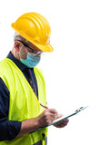 Engineer isolated on white background wears surgical mask to prevent Coronavirus spread, holds pen and notebook in hand. Preventing Pandemic Covid-19 at the workplace.