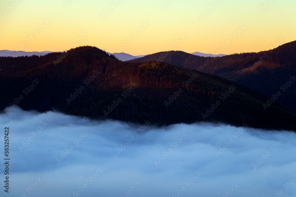 Majestic sunrise in the mountains landscape, beautiful dawn with fog