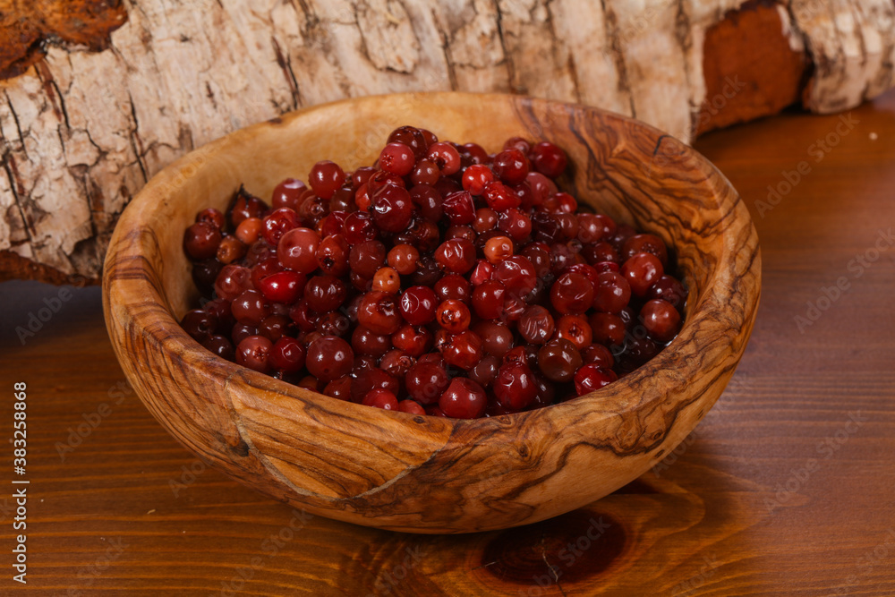 Traditional soaked cowberry in the bowl Traditional soaked cowberry in the bowl