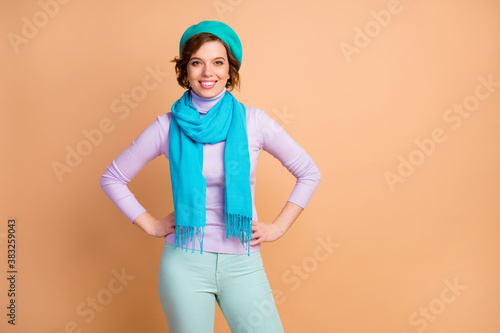 Portrait of her she nice-looking attractive lovely lovable winsome pretty charming cheerful cheery girl wearing blue beret scarf isolated over beige pastel color background
