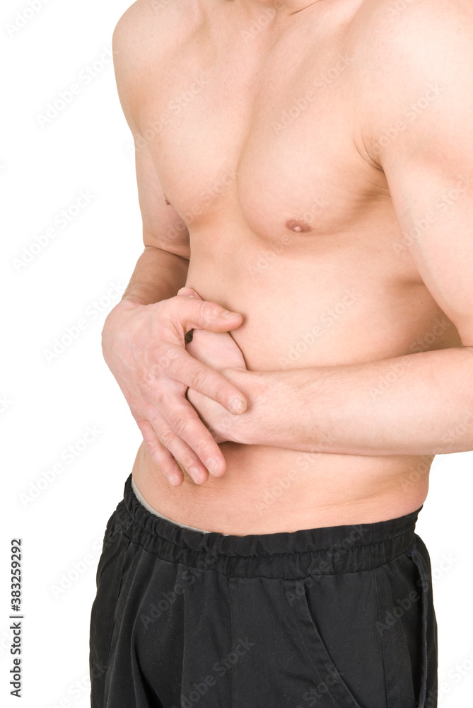 Fototapeta premium A man with a naked torso holds his stomach on a white background