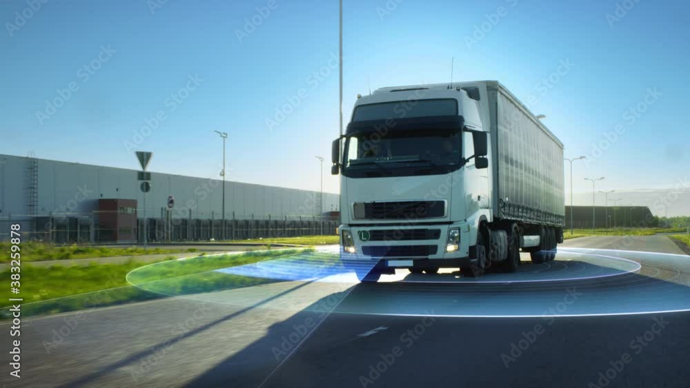 Advanced High-Tech Concept: Big Autonomous Semi-Truck with Cargo Trailer Drives on the Road with Concept Sensors Scanning. Graphics, Special Effects of Futuristic Self Driving Truck Analyzing Freeway Advanced High-Tech Concept: Big Autonomous Semi-Truck with Cargo Trailer Drives on the Road with Concept Sensors Scanning. Graphics, Special Effects of Futuristic Self Driving Truck Analyzing Freeway